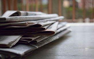 Photo of Newspapers on Table
